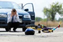 A man frustrated after an accident with a bicycle