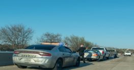 Police car beside car accident scene